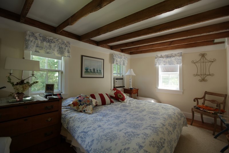 29 Glendale Road Stockbridge, MA 01262 - Photo 11 of 23 a bedroom with a bed and wooden floor