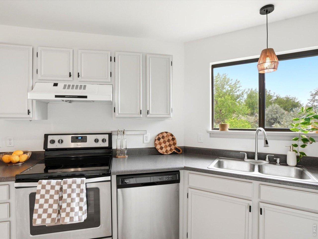 4945 Twin Lakes Road, Unit 46 Boulder, CO 80301 - Photo 21 of 42 Natural light pours into the kitchen, creating a bright and cheerful workspace.