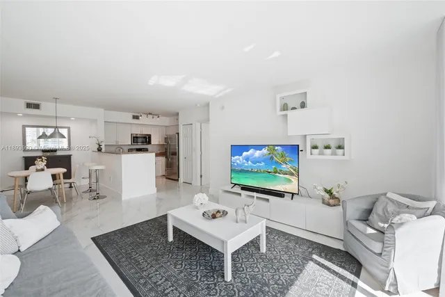 a kitchen with a refrigerator stove and microwave