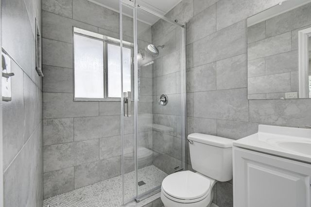 a kitchen with stainless steel appliances granite countertop a refrigerator stove a sink and a microwave