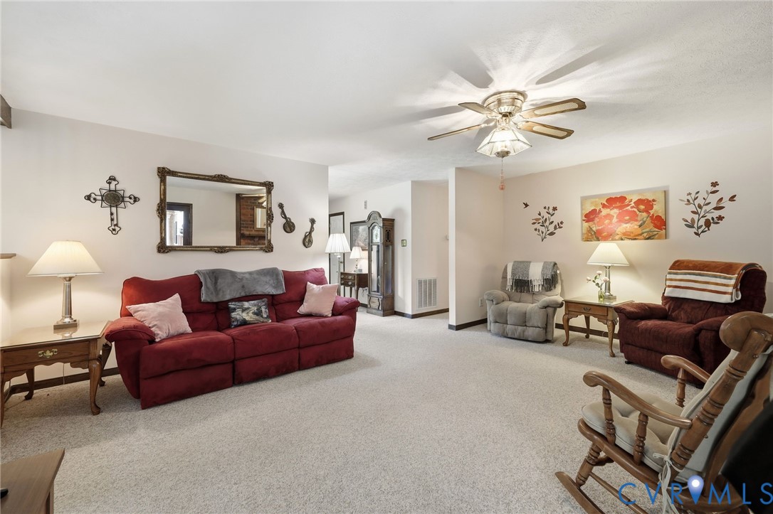 10111 Tunstall Road New Kent, VA 23124 - Photo 21 of 52 Spacious living area featuring light-toned carpeti
