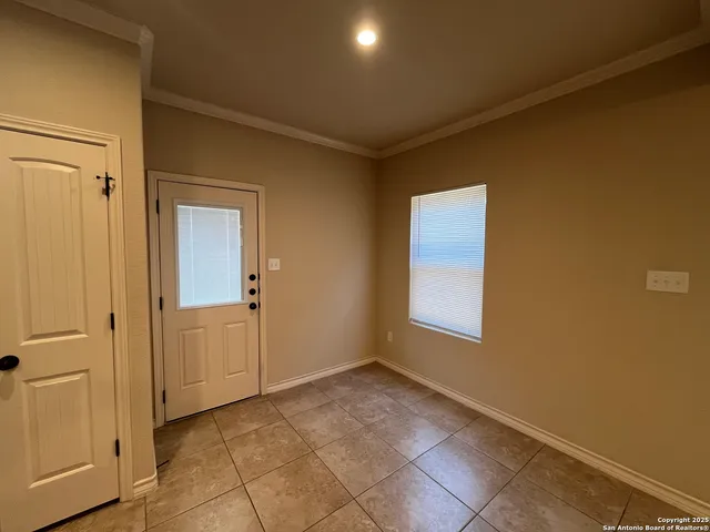 a view of an empty room and window