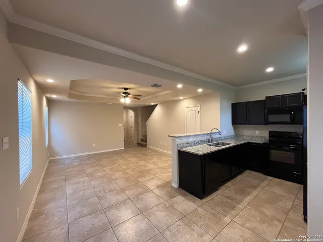 a kitchen with a cabinets and appliances