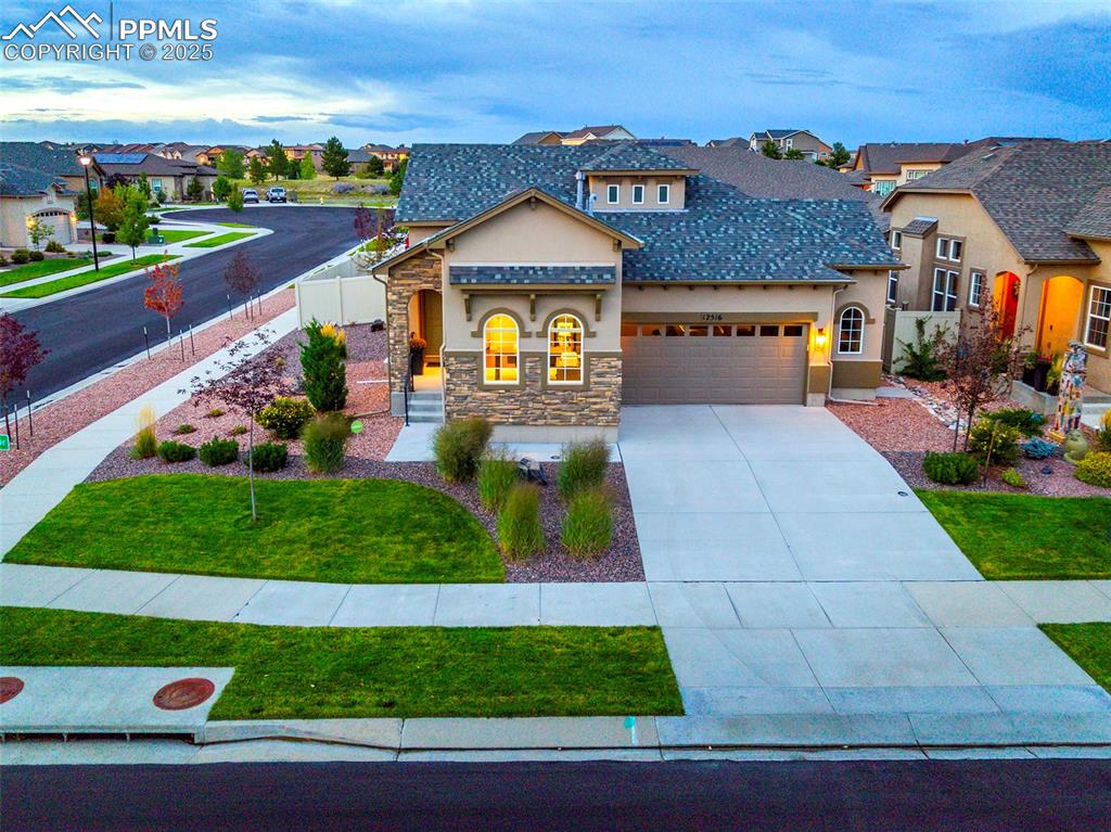 a front view of a house with garden