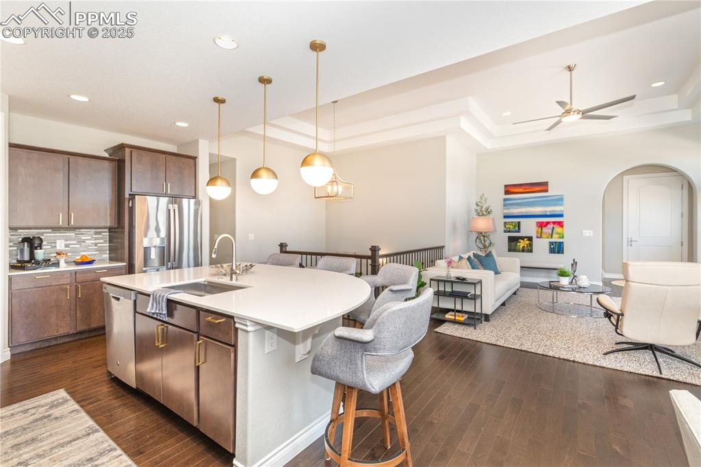 12516 Stone Valley Drive Peyton, CO 80831 - Photo 13 of 44 a large kitchen with a table and chairs