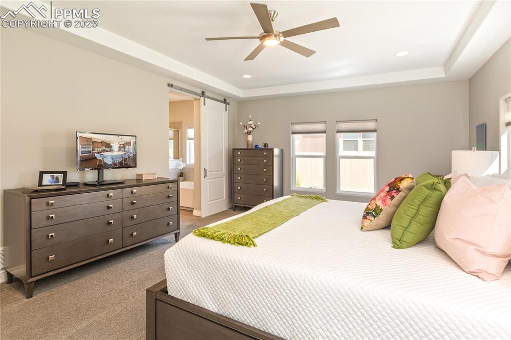 12516 Stone Valley Drive Peyton, CO 80831 - Photo 21 of 44 a bedroom with a bed and a dresser