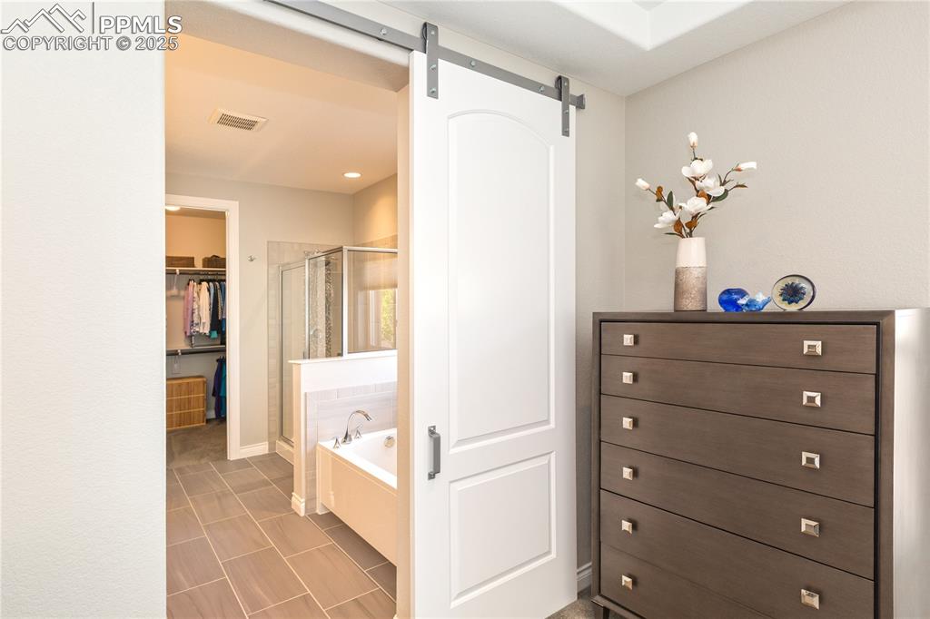 12516 Stone Valley Drive Peyton, CO 80831 - Photo 22 of 44 a view of a hallway view with wooden floor