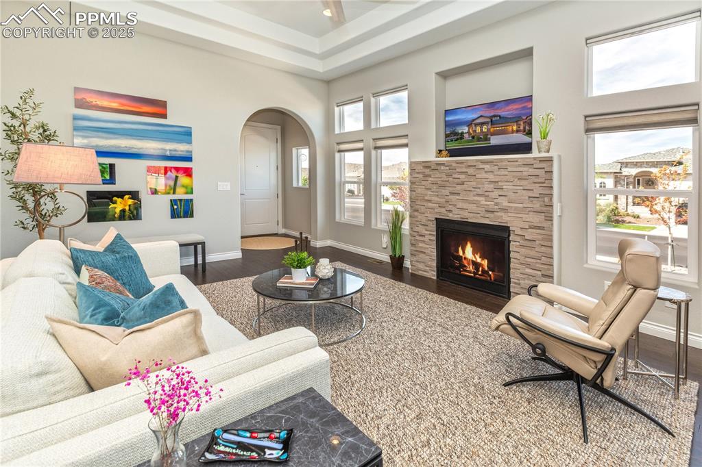 12516 Stone Valley Drive Peyton, CO 80831 - Photo 26 of 44 a living room with furniture and a fireplace
