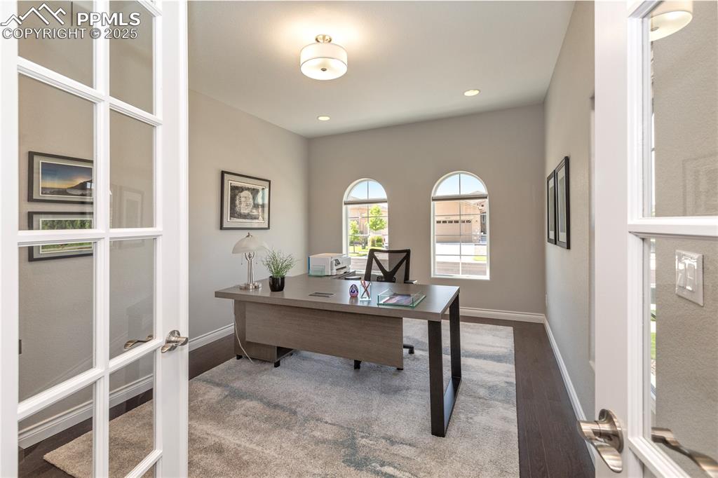 12516 Stone Valley Drive Peyton, CO 80831 - Photo 27 of 44 a view of a workspace with furniture and a window