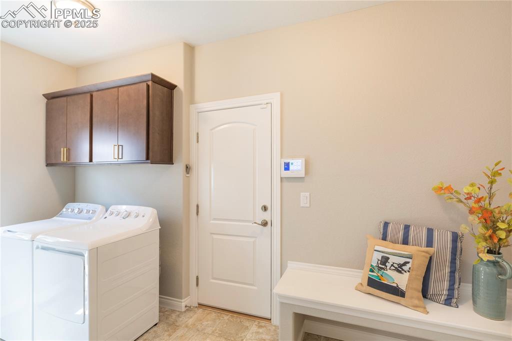 12516 Stone Valley Drive Peyton, CO 80831 - Photo 30 of 44 a utility room with dryer and washer