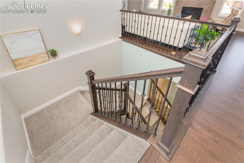 12516 Stone Valley Drive Peyton, CO 80831 - Photo 31 of 44 a view of staircase with railing and white walls