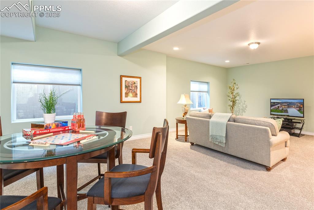 12516 Stone Valley Drive Peyton, CO 80831 - Photo 33 of 44 a living room with furniture and a table