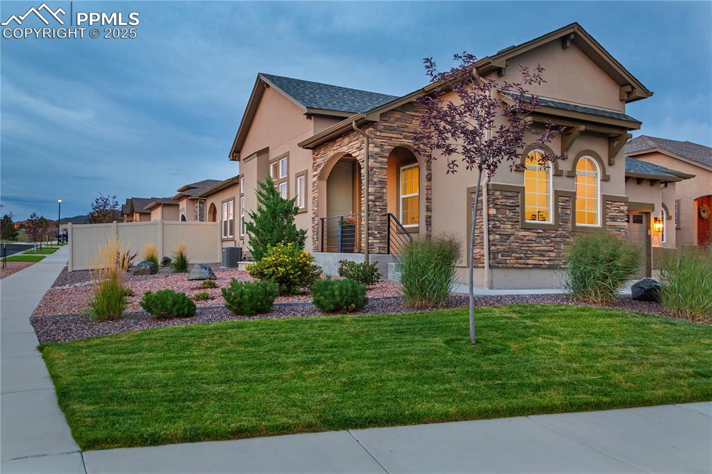 12516 Stone Valley Drive Peyton, CO 80831 - Photo 4 of 44 front view of a house with a yard