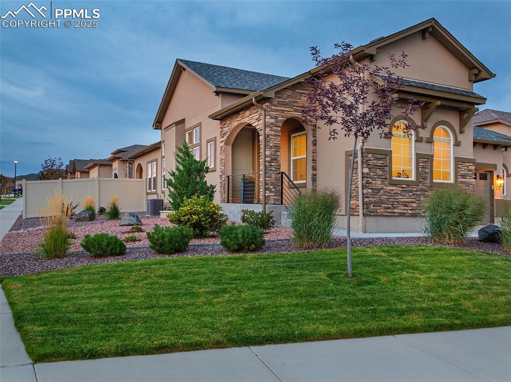 12516 Stone Valley Drive Peyton, CO 80831 - Photo 42 of 44 front view of a house with a yard