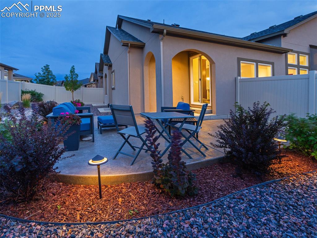 12516 Stone Valley Drive Peyton, CO 80831 - Photo 43 of 44 a view of a chairs and table in patio