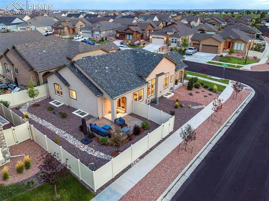 12516 Stone Valley Drive Peyton, CO 80831 - Photo 5 of 44 an aerial view of a house with a garden