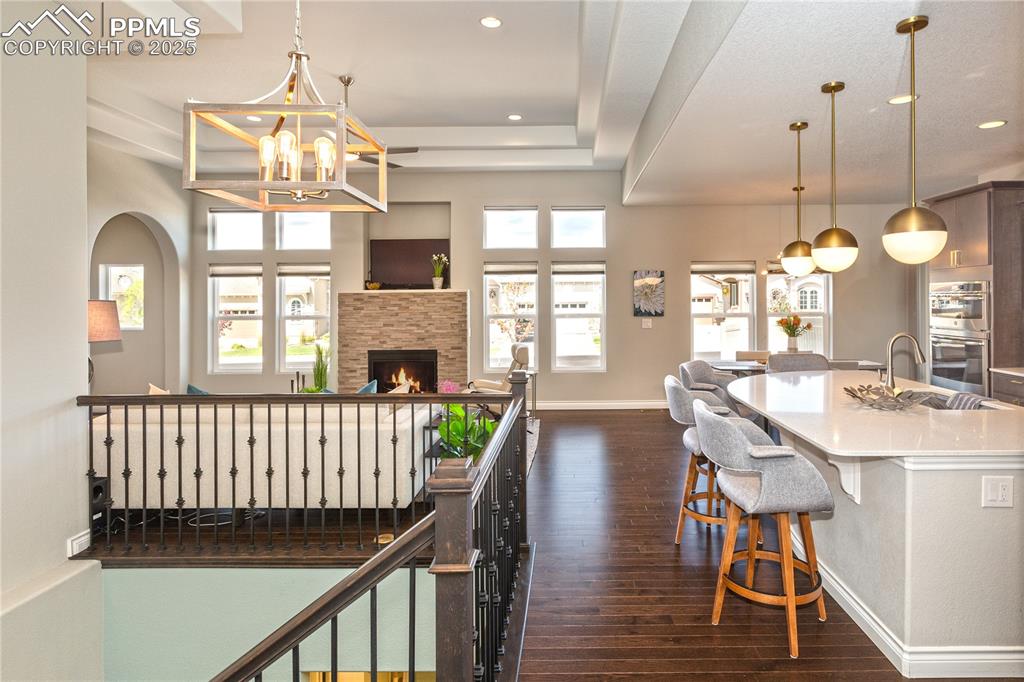 12516 Stone Valley Drive Peyton, CO 80831 - Photo 10 of 44 a view of a dining room with furniture window and wooden floor