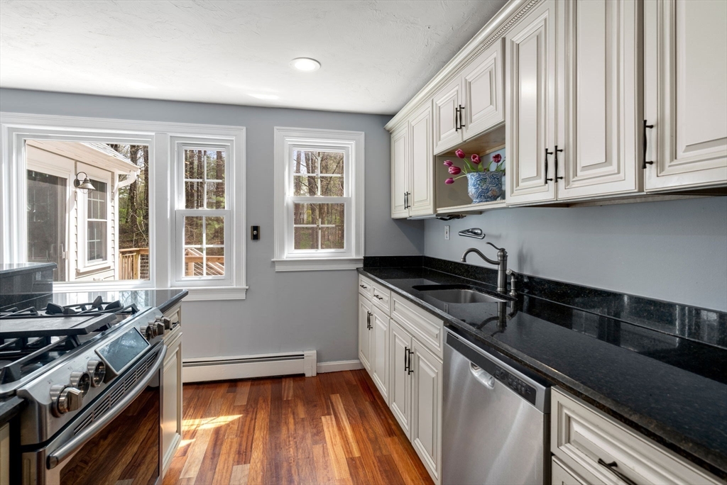27 Middle Road Sudbury, MA 01776 - Photo 13 of 33 a kitchen with stainless steel appliances granite countertop a stove and a sink