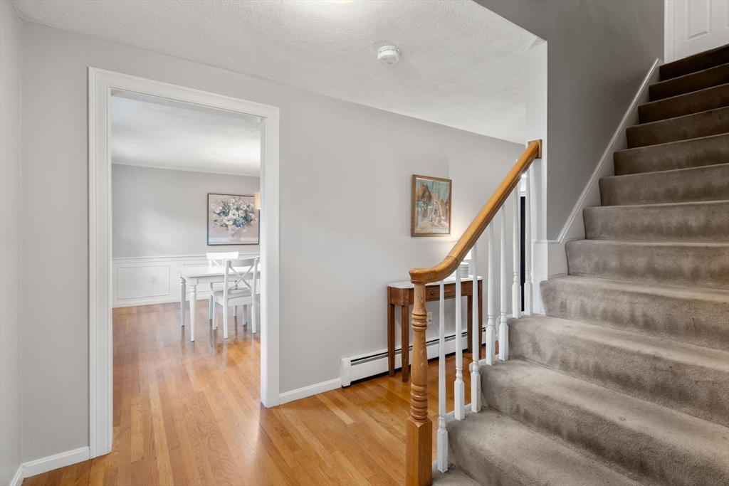 27 Middle Road Sudbury, MA 01776 - Photo 18 of 33 a view of entryway and hall with wooden floor