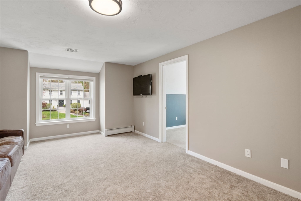 27 Middle Road Sudbury, MA 01776 - Photo 24 of 33 a view of an empty room with a window