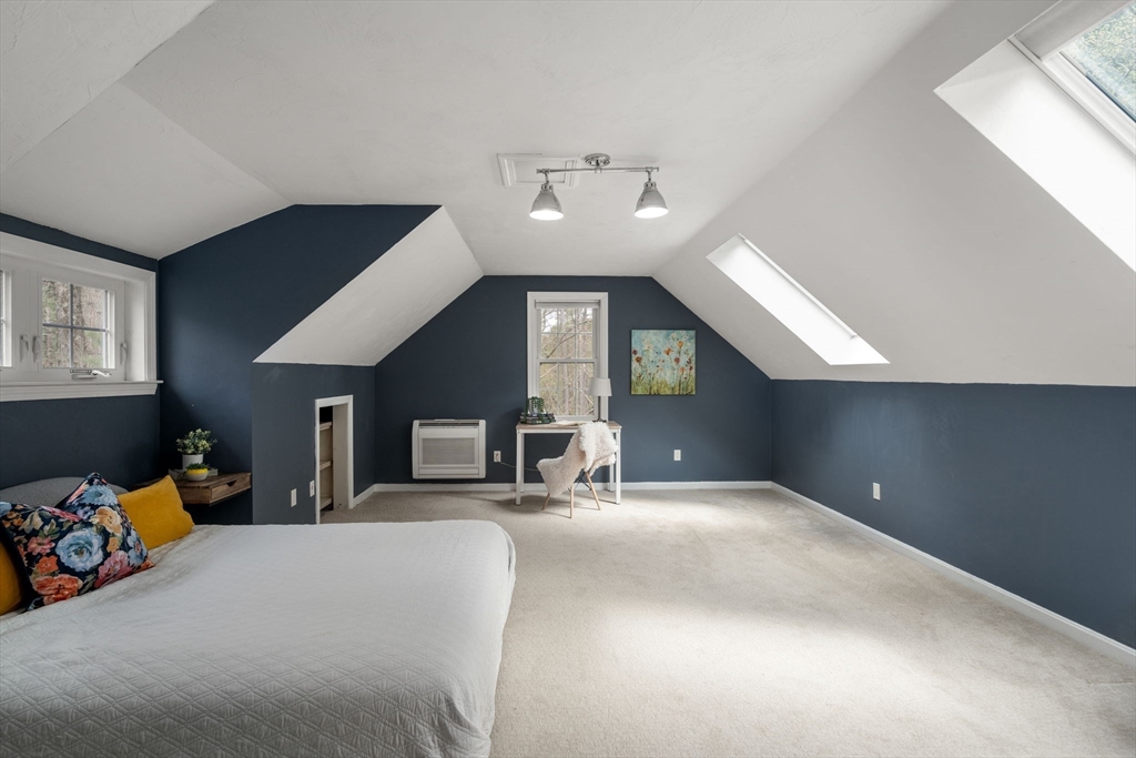 27 Middle Road Sudbury, MA 01776 - Photo 25 of 33 a bed room with a bed furniture and a tv