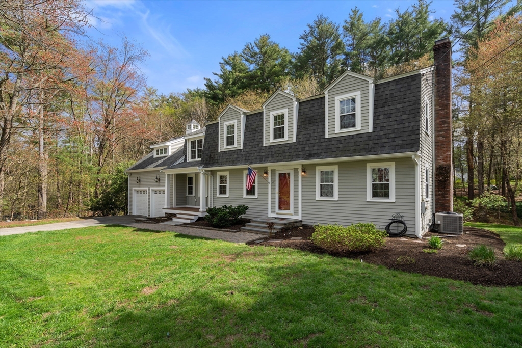 27 Middle Road Sudbury, MA 01776 - Photo 3 of 33 a front view of a house with garden and porch