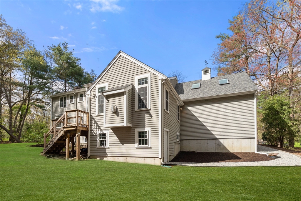 27 Middle Road Sudbury, MA 01776 - Photo 32 of 33 a front view of house with yard and green space