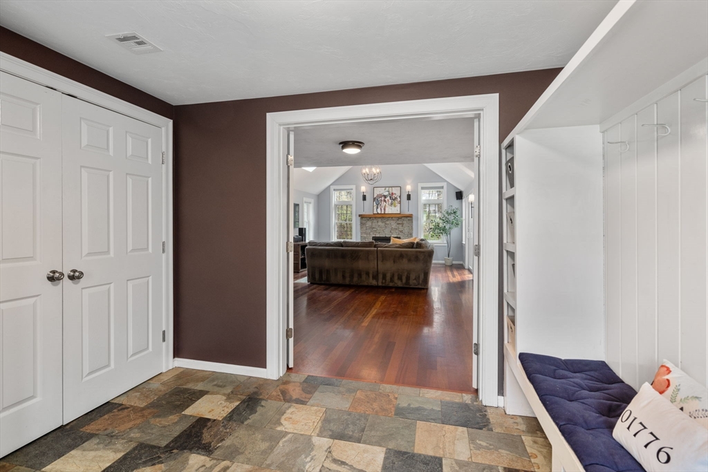 27 Middle Road Sudbury, MA 01776 - Photo 5 of 33 a view of a hallway and a livingroom with furniture