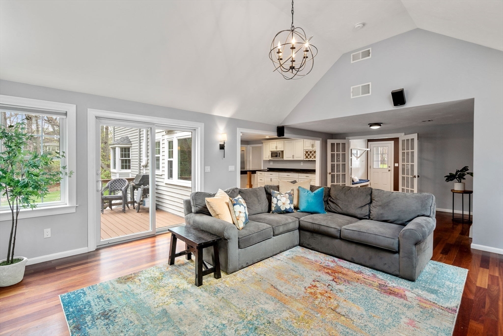 27 Middle Road Sudbury, MA 01776 - Photo 6 of 33 a living room with furniture wooden floor and a large window