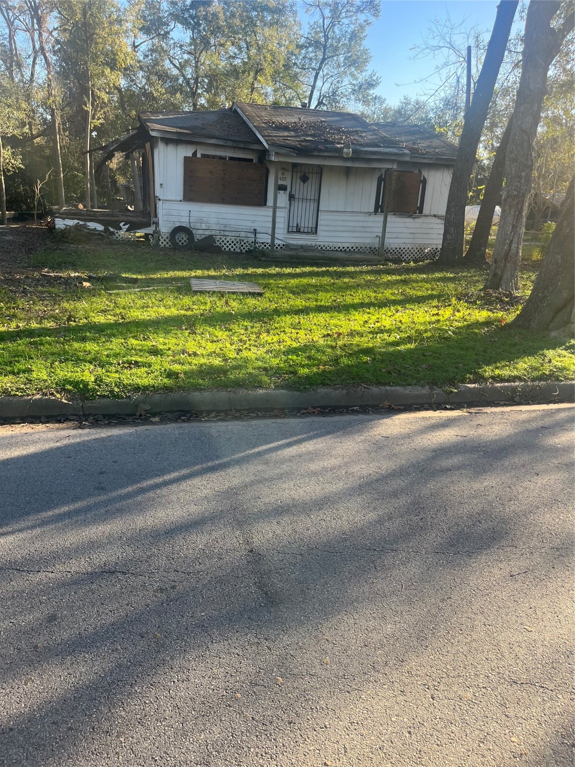 409 Wagers Street Conroe, TX 77301 - Photo 18 of 21 a front view of a house with a yard