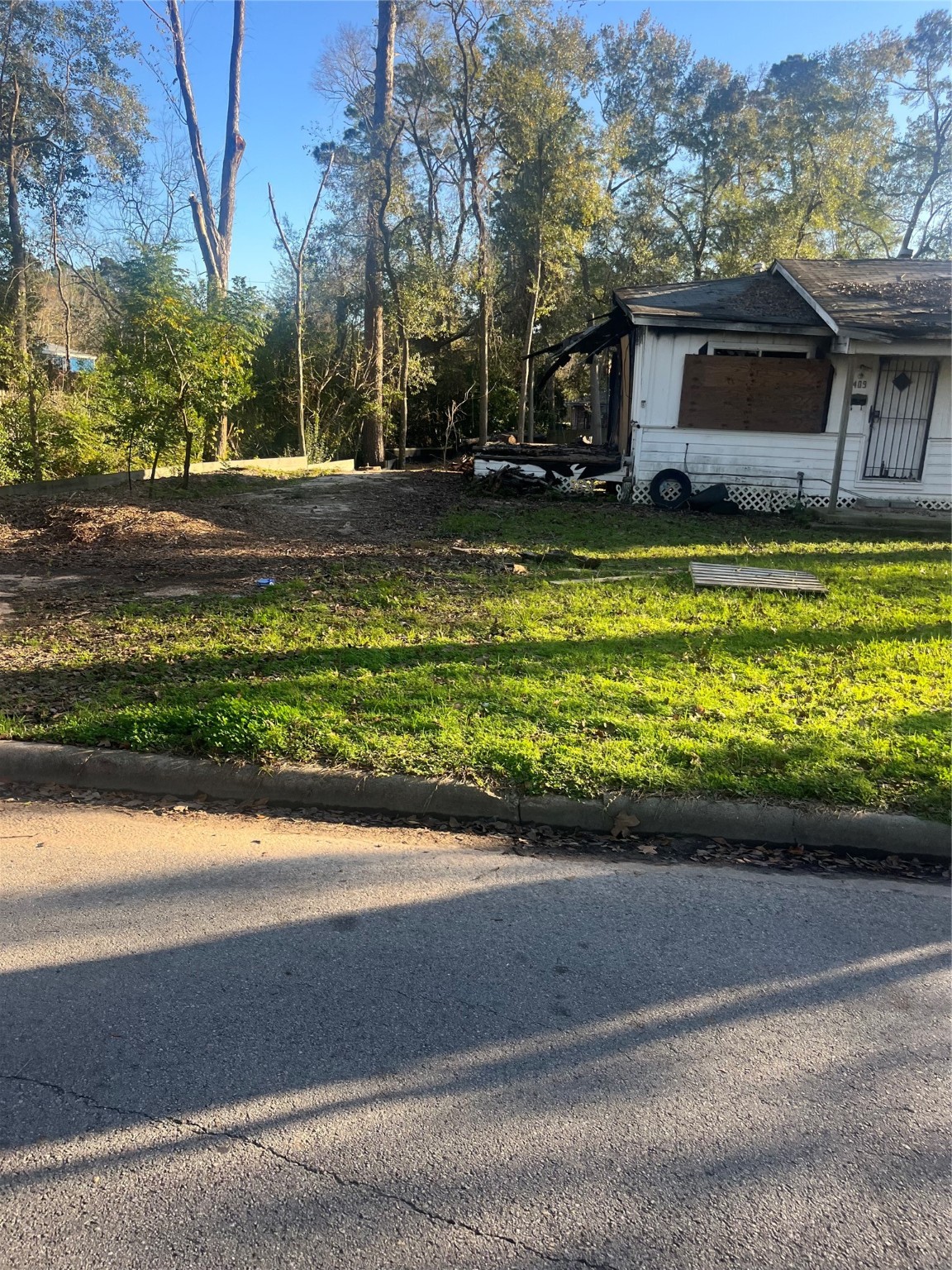 409 Wagers Street Conroe, TX 77301 - Photo 21 of 21 a front view of a house with a yard