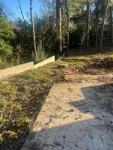 a view of a yard with trees