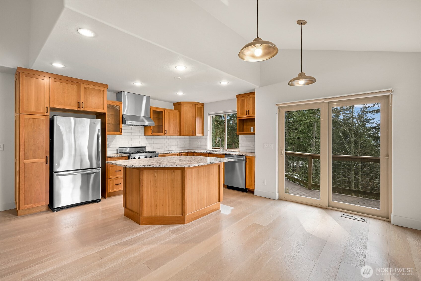 4135 Agate Road Bellingham, WA 98226 - Photo 13 of 36 a kitchen with stainless steel appliances granite countertop a refrigerator a sink a stove a microwave and island