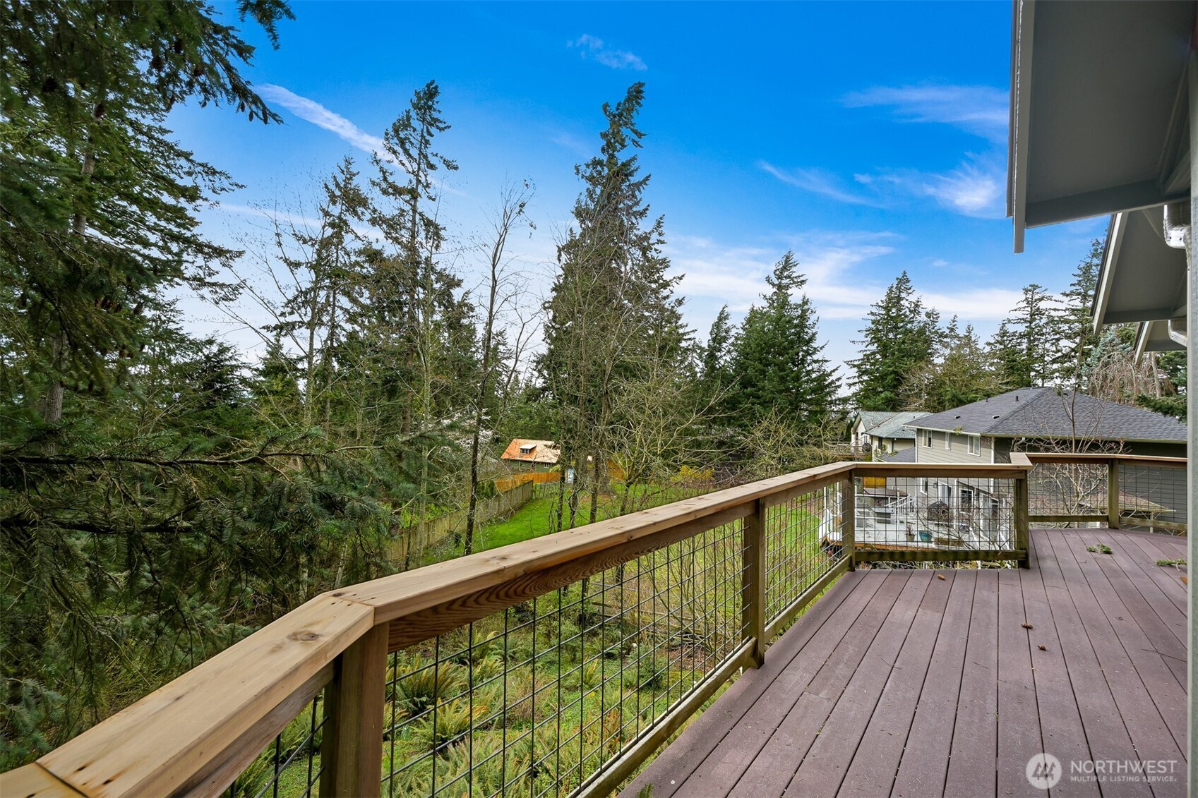 4135 Agate Road Bellingham, WA 98226 - Photo 14 of 36 a view of a balcony with wooden floor and outdoor seating