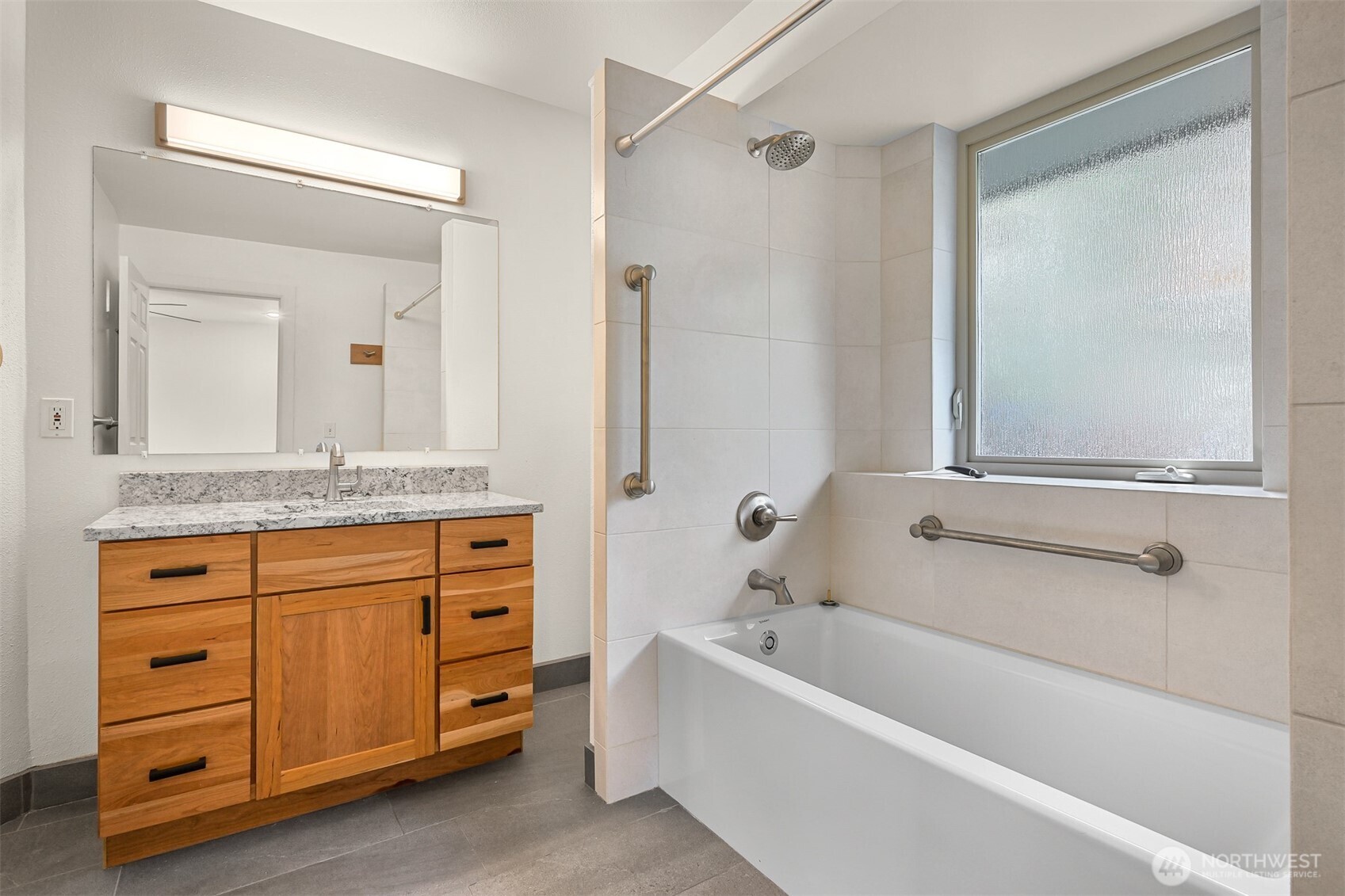 4135 Agate Road Bellingham, WA 98226 - Photo 18 of 36 a bathroom with a granite countertop tub sink and mirror
