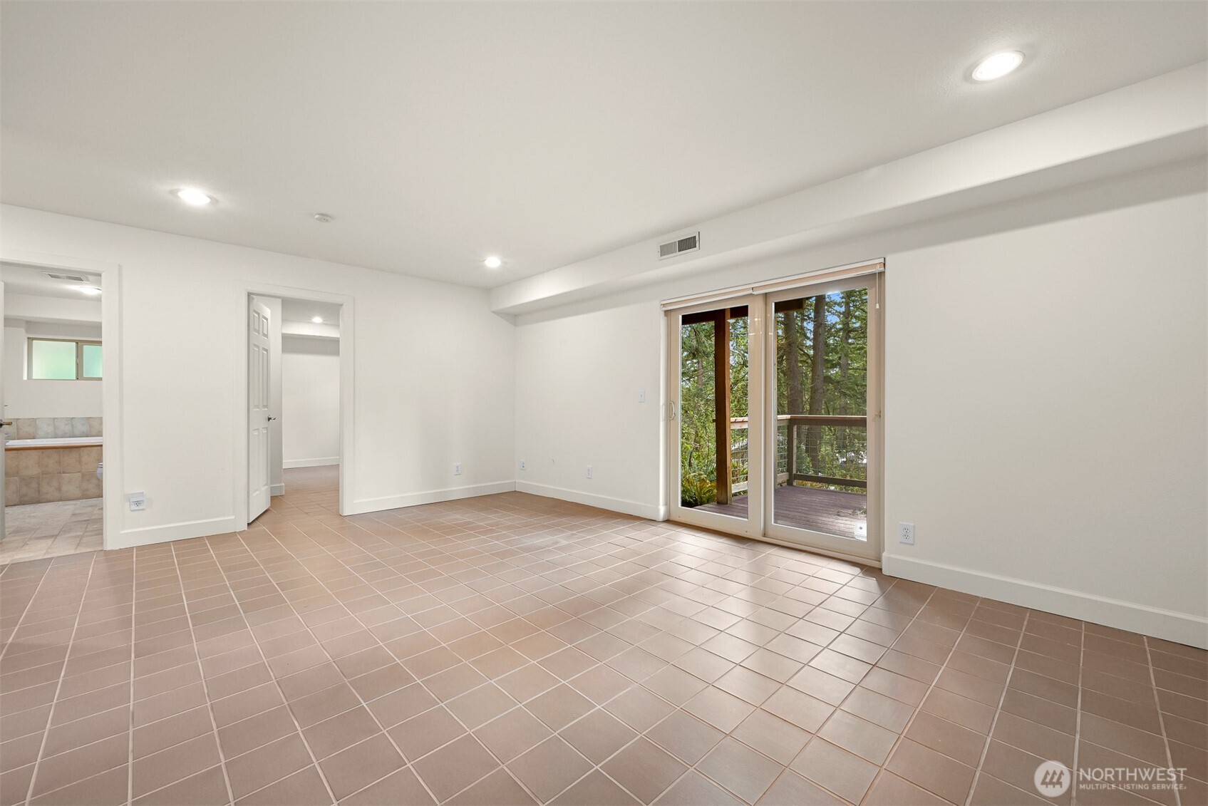 4135 Agate Road Bellingham, WA 98226 - Photo 21 of 36 a view of an empty room with glass door