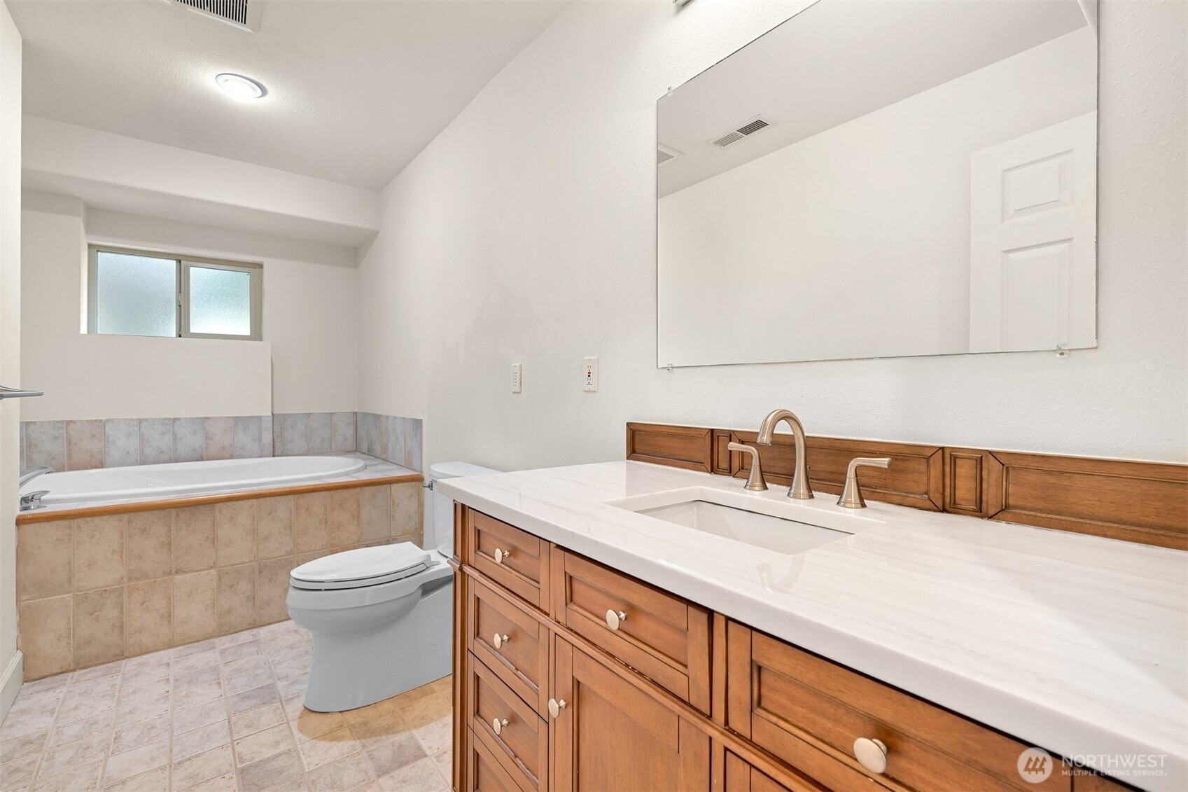 4135 Agate Road Bellingham, WA 98226 - Photo 27 of 36 a bathroom with a sink a toilet and a bathtub
