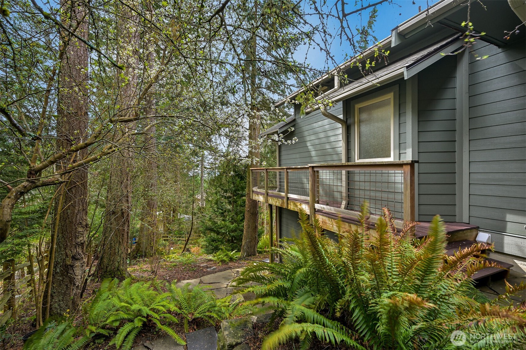 4135 Agate Road Bellingham, WA 98226 - Photo 31 of 36 a backyard of a house with lots of green space and fountain