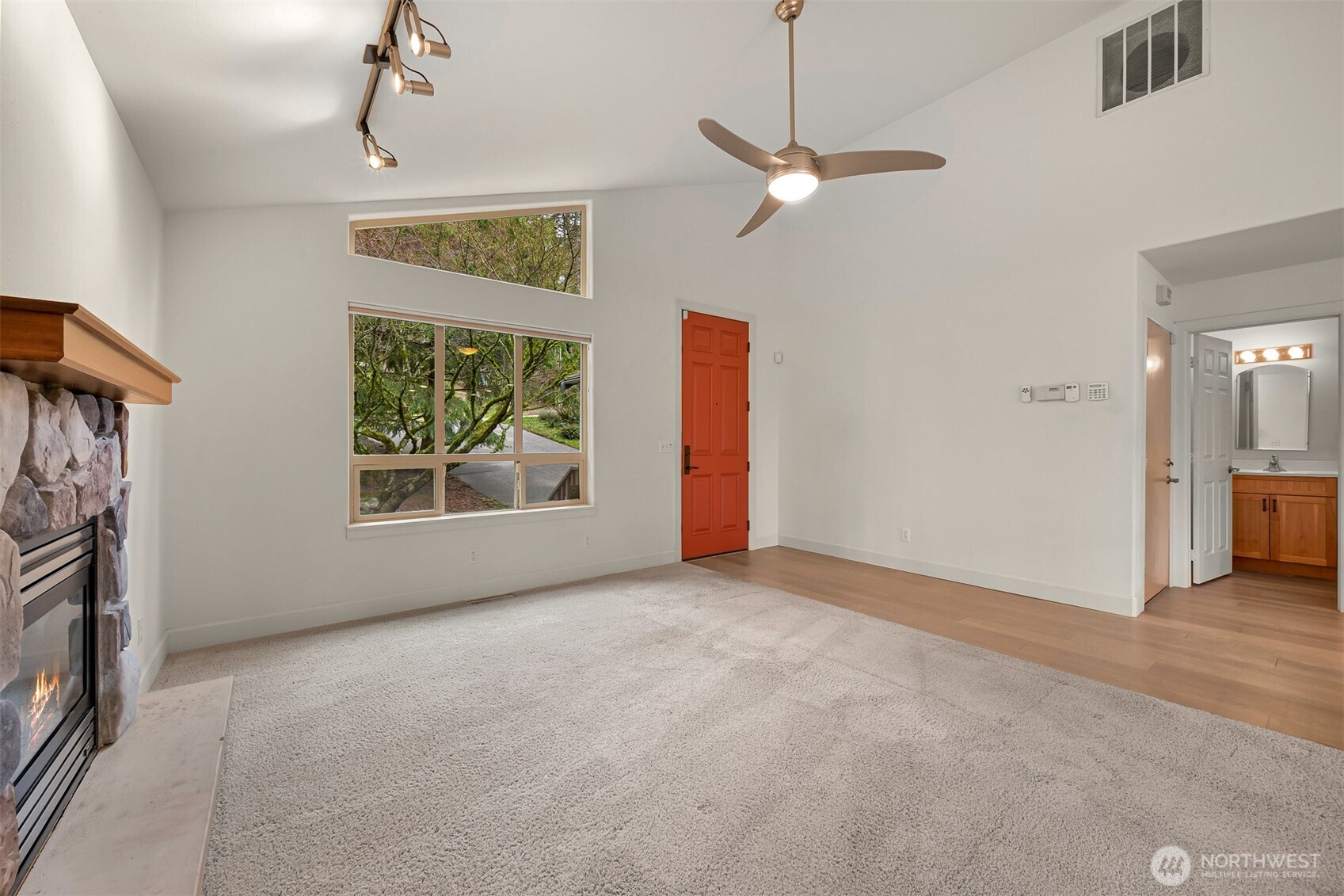 4135 Agate Road Bellingham, WA 98226 - Photo 4 of 36 a view of an empty room with a fireplace and a window