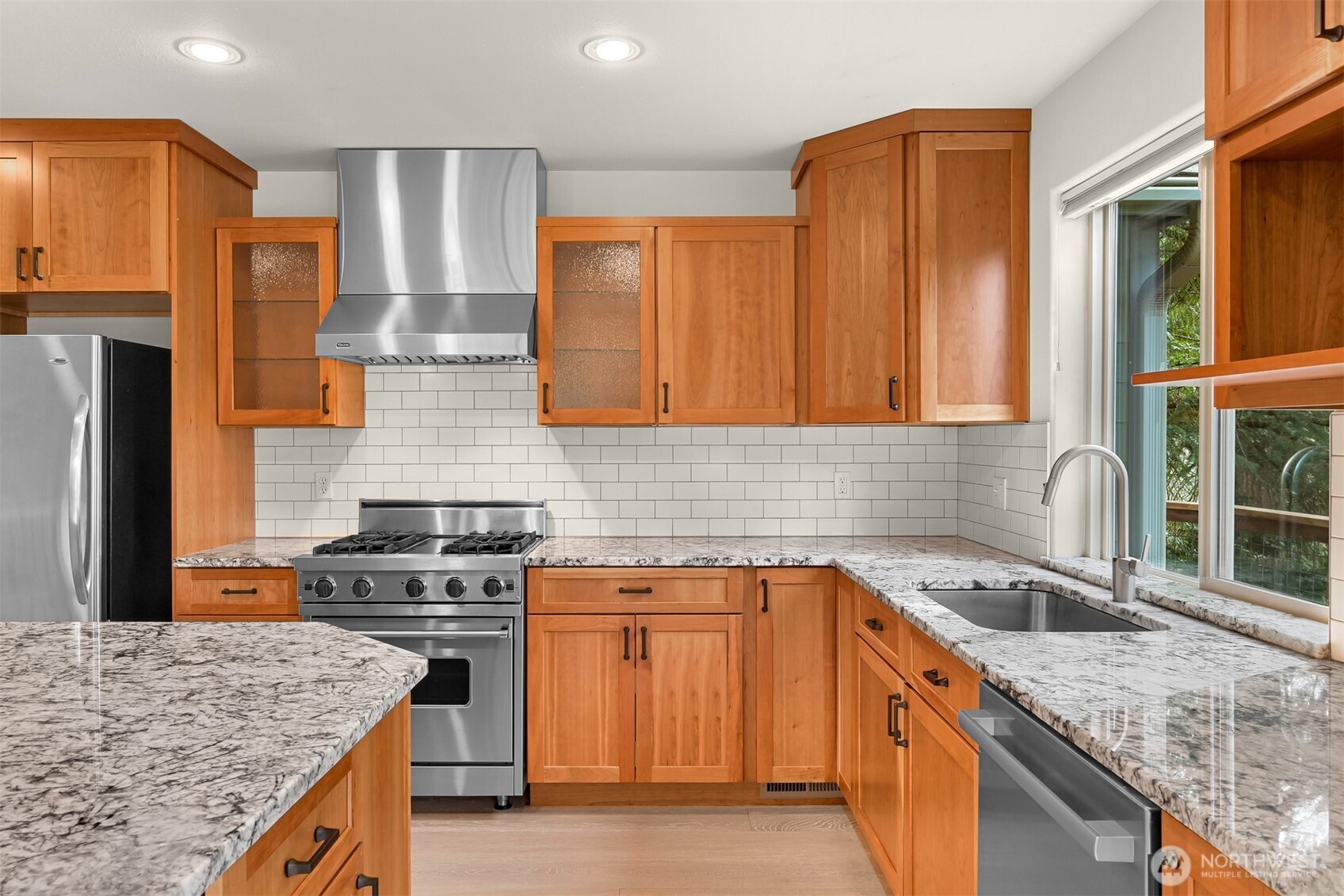 4135 Agate Road Bellingham, WA 98226 - Photo 9 of 36 a kitchen with stainless steel appliances granite countertop a sink stove and refrigerator