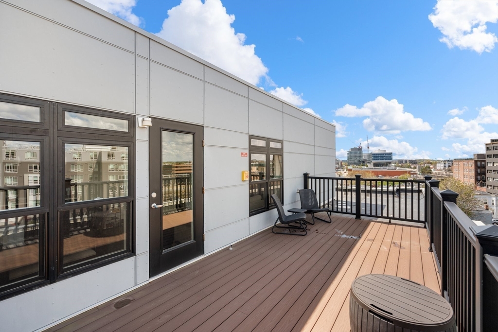 20 Penniman Road, Unit P3 Boston, MA 02134 - Photo 19 of 22 a view of balcony with a large window and wooden floor