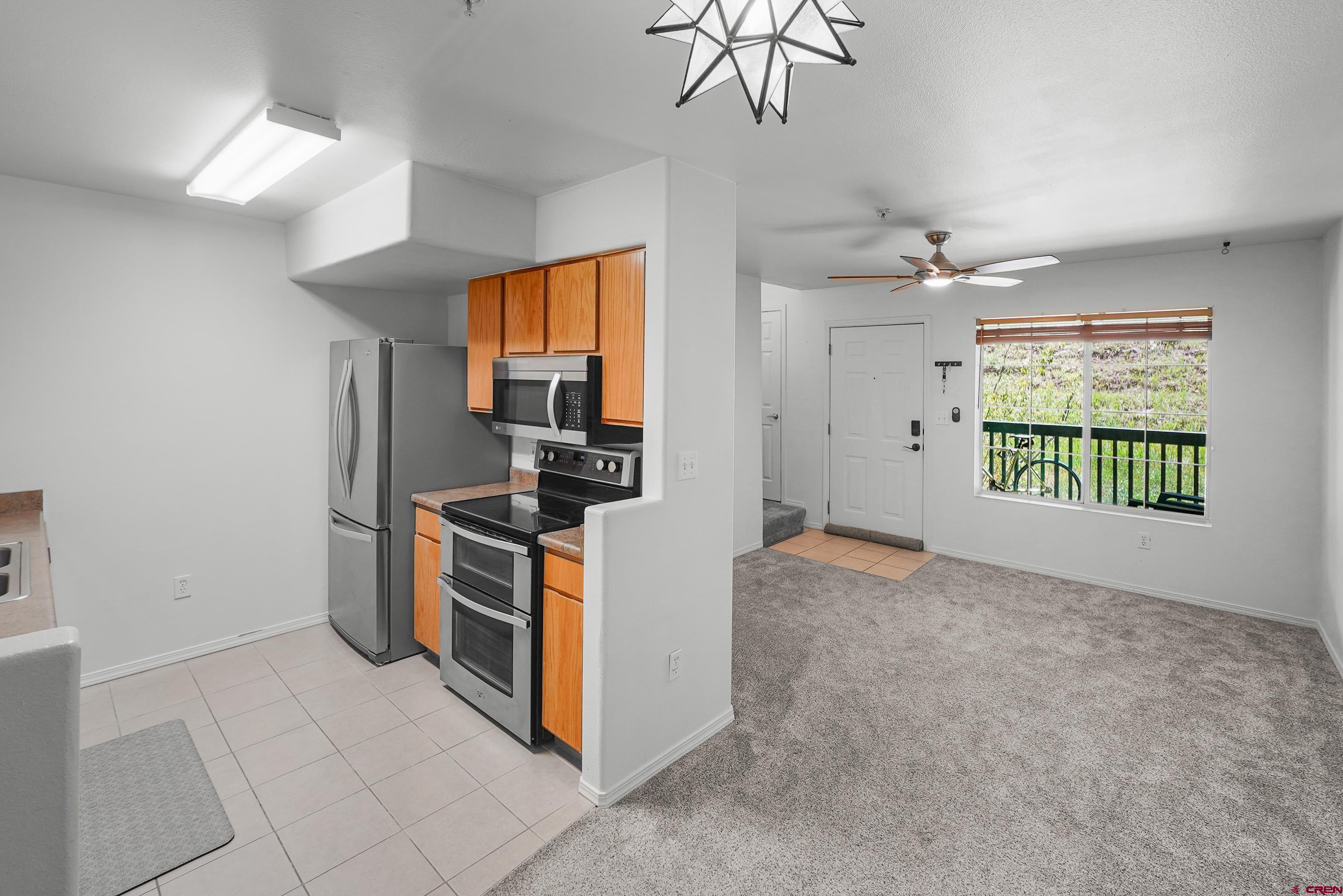 1100 Goeglein Gulch Road, Unit 163 Durango, CO 81301 - Photo 13 of 23 a view of a kitchen with furniture and a kitchen