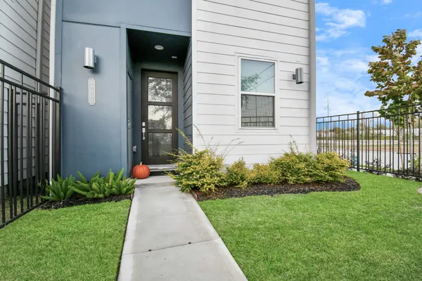 a front view of a house with garden