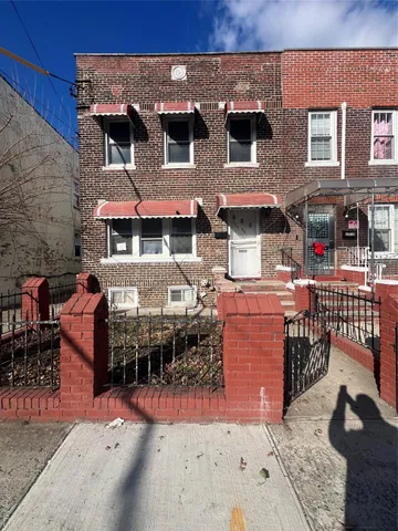 a front view of a house with parking