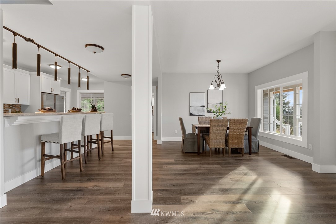 14126 Littlerock Road Southwest Rochester, WA 98579 - Photo 16 of 40 a view of a dining room with furniture window and wooden floor