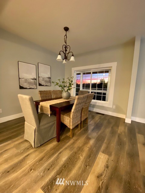 14126 Littlerock Road Southwest Rochester, WA 98579 - Photo 17 of 40 a living room with a couch and chandelier