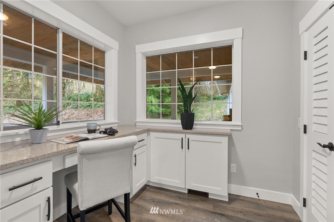 14126 Littlerock Road Southwest Rochester, WA 98579 - Photo 20 of 40 a kitchen with a window a sink and cabinets