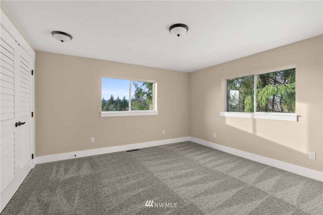 14126 Littlerock Road Southwest Rochester, WA 98579 - Photo 23 of 40 a view of an empty room with a window