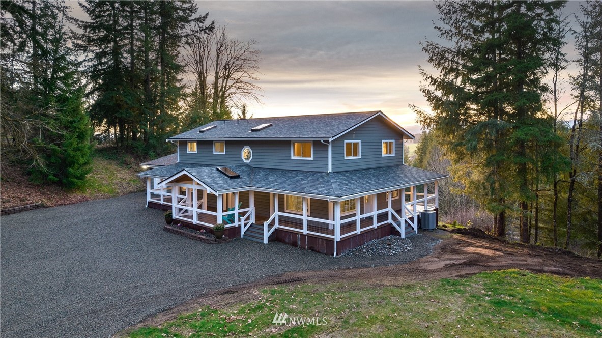 14126 Littlerock Road Southwest Rochester, WA 98579 - Photo 3 of 40 a view of a house with a yard and wooden deck