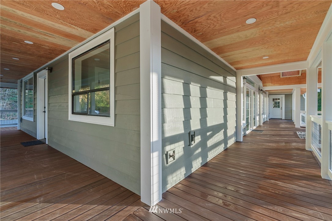 14126 Littlerock Road Southwest Rochester, WA 98579 - Photo 7 of 40 a view of a porch with wooden floor and stairs